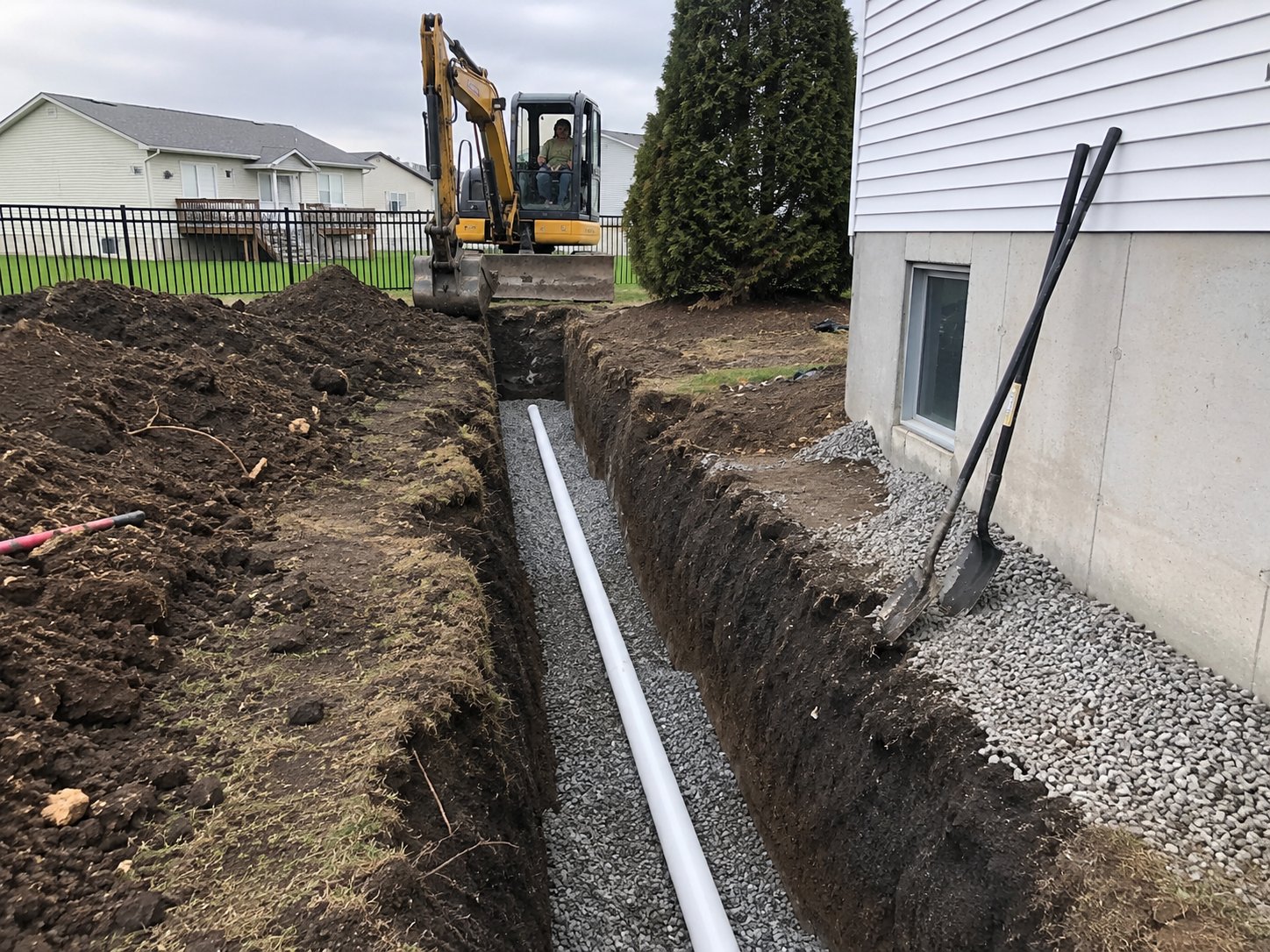 Drainage system installation with foundation gravel near Ubly, MI